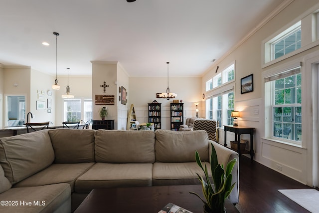 411 Canvasback Ln, Sneads Ferry, NC 28460 - living area with dark wood-style floors, ornamental molding, a chandelier, and recessed lighting