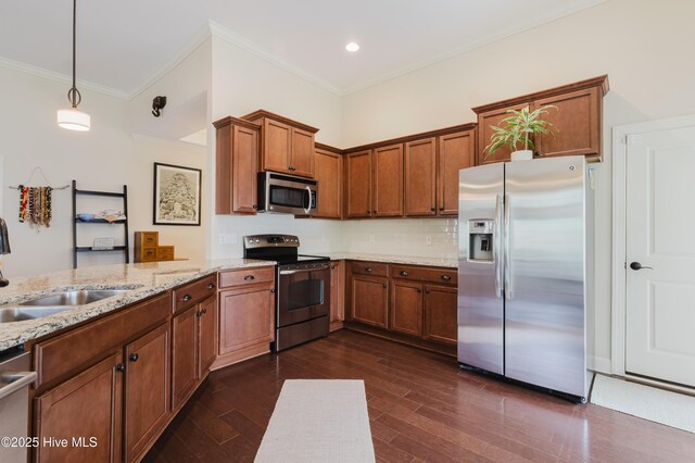 411 Canvasback Ln, Sneads Ferry, NC 28460 - kitchen featuring stainless steel appliances, brown cabinetry, light stone countertops, a sink, and decorative backsplash