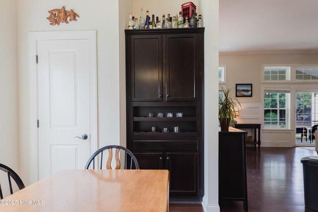 411 Canvasback Ln, Sneads Ferry, NC 28460 - dining room with crown molding and dark wood-style flooring