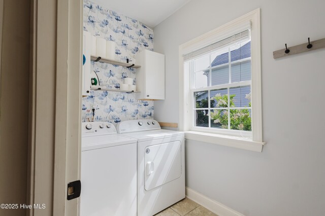 411 Canvasback Ln, Sneads Ferry, NC 28460 - laundry area featuring separate washer and dryer, cabinet space, light tile patterned floors, and baseboards