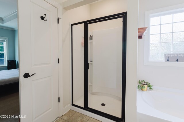 411 Canvasback Ln, Sneads Ferry, NC 28460 - bathroom with a stall shower, a garden tub, ensuite bathroom, crown molding, and tile patterned flooring