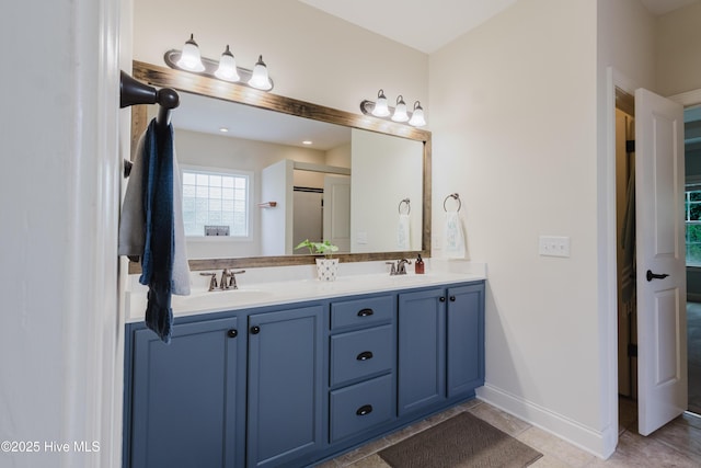 411 Canvasback Ln, Sneads Ferry, NC 28460 - bathroom with double vanity and baseboards
