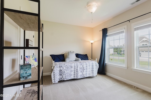 411 Canvasback Ln, Sneads Ferry, NC 28460 - carpeted bedroom with baseboards