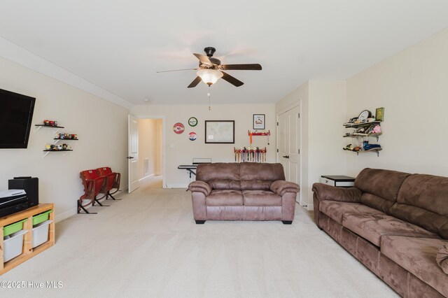 411 Canvasback Ln, Sneads Ferry, NC 28460 - living room with a ceiling fan, light carpet, and baseboards