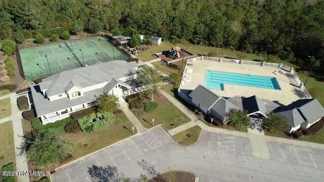 411 Canvasback Ln, Sneads Ferry, NC 28460 - aerial view of property and surrounding area with a pool and a forest