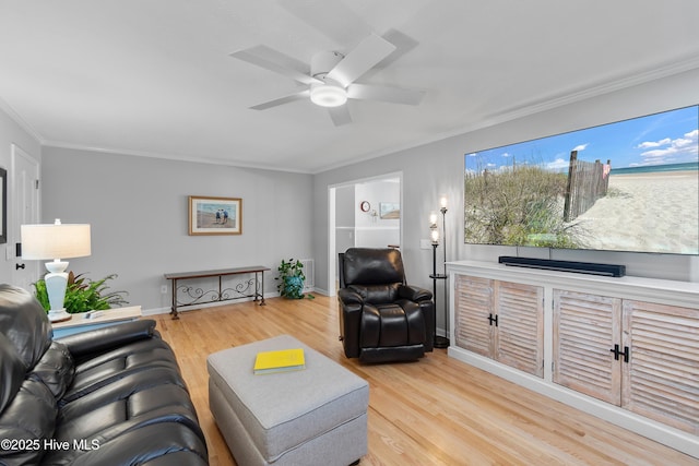 827 Village Point Rd SW, Shallotte, NC 28470 - living area featuring light wood-type flooring, ornamental molding, ceiling fan, and baseboards