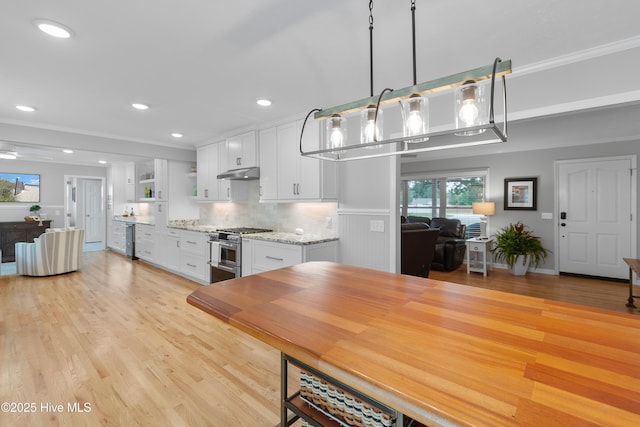 827 Village Point Rd SW, Shallotte, NC 28470 - kitchen with double oven range, under cabinet range hood, open shelves, beverage cooler, and white cabinetry