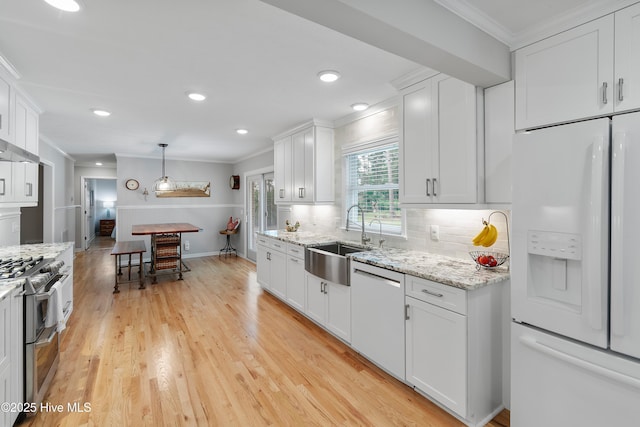 827 Village Point Rd SW, Shallotte, NC 28470 - kitchen with white appliances, a sink, ornamental molding, white cabinets, and tasteful backsplash