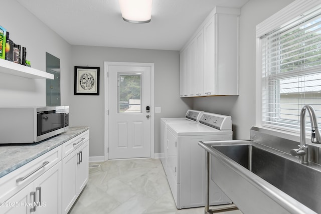 827 Village Point Rd SW, Shallotte, NC 28470 - laundry area with washer and dryer, a sink, light marble finish flooring, and baseboards