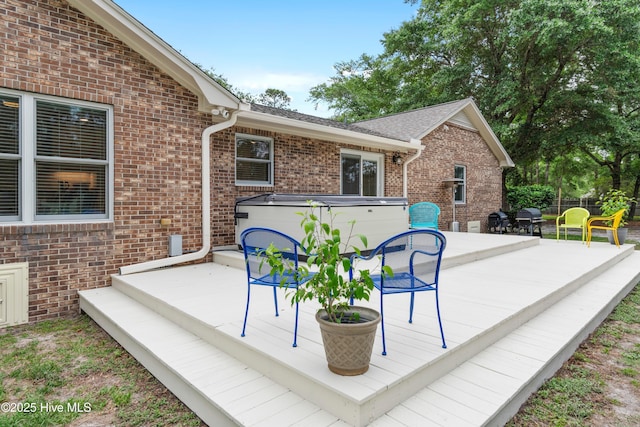 827 Village Point Rd SW, Shallotte, NC 28470 - wooden deck with a hot tub and grilling area