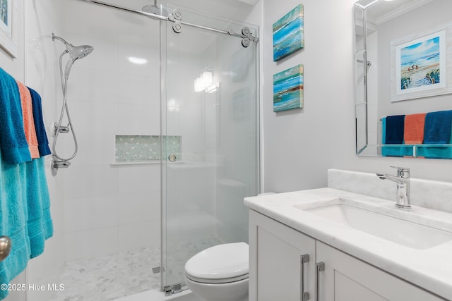 827 Village Point Rd SW, Shallotte, NC 28470 - bathroom featuring vanity, a stall shower, toilet, and ornamental molding