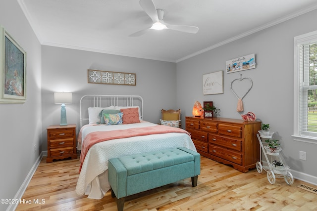 827 Village Point Rd SW, Shallotte, NC 28470 - bedroom featuring light wood-type flooring, crown molding, baseboards, and ceiling fan