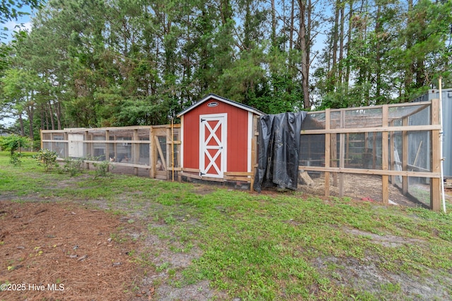827 Village Point Rd SW, Shallotte, NC 28470 - view of poultry coop featuring view of wooded area