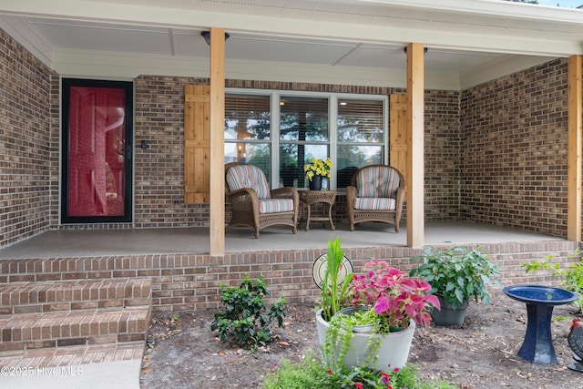 827 Village Point Rd SW, Shallotte, NC 28470 - property entrance with a porch and brick siding
