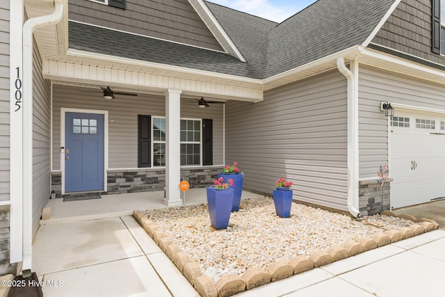 1005 Flounder Run, New Bern, NC 28562 - doorway to property featuring roof with shingles, covered porch, ceiling fan, and stone siding