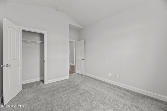 1005 Flounder Run, New Bern, NC 28562 - unfurnished bedroom featuring carpet floors, vaulted ceiling, a closet, and baseboards