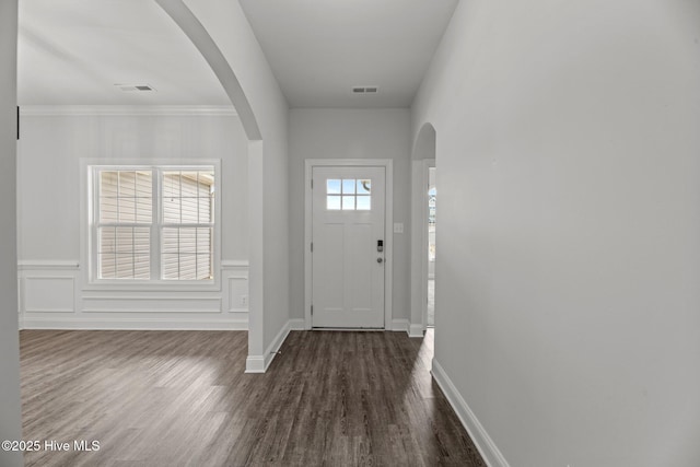 1005 Flounder Run, New Bern, NC 28562 - foyer featuring dark wood finished floors, baseboards, and arched walkways