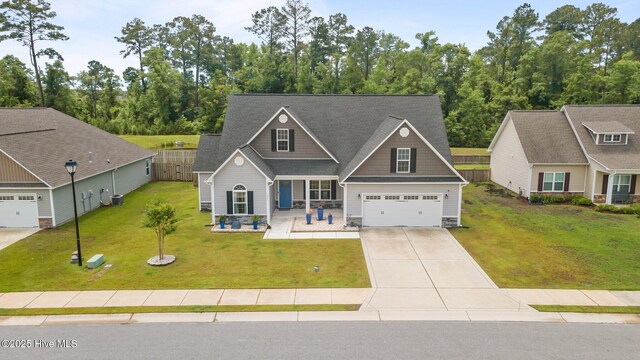 1005 Flounder Run, New Bern, NC 28562 - view of front of house with concrete driveway, a porch, an attached garage, and stone siding