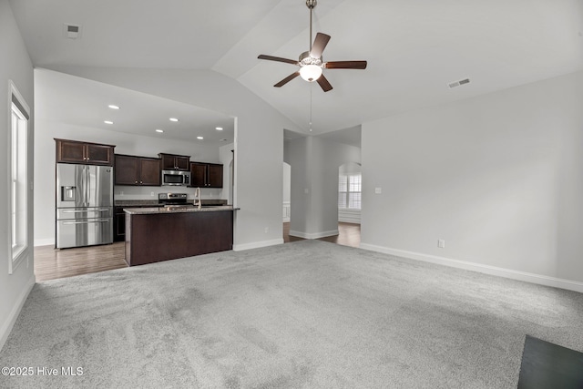 1005 Flounder Run, New Bern, NC 28562 - unfurnished living room featuring lofted ceiling, ceiling fan, carpet, baseboards, and recessed lighting