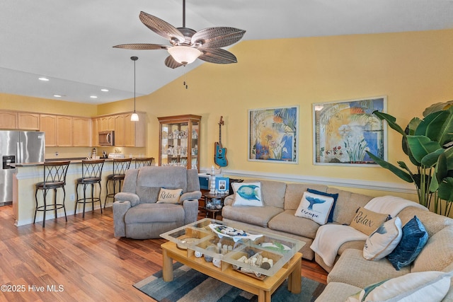 4256 Anderson Dr SE, Southport, NC 28461 - living room featuring lofted ceiling, wood finished floors, ceiling fan, and recessed lighting