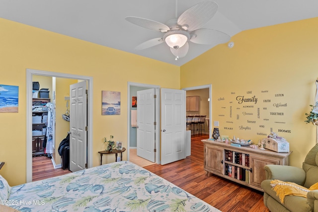 4256 Anderson Dr SE, Southport, NC 28461 - bedroom with wood finished floors, a walk in closet, a closet, and vaulted ceiling