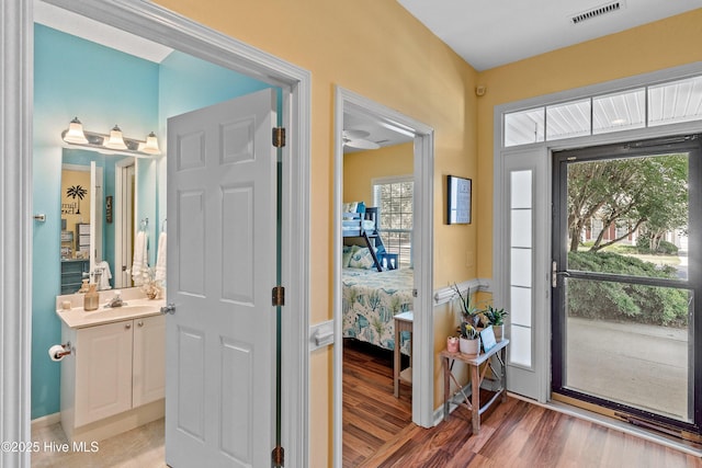 4256 Anderson Dr SE, Southport, NC 28461 - foyer entrance with plenty of natural light and light wood finished floors