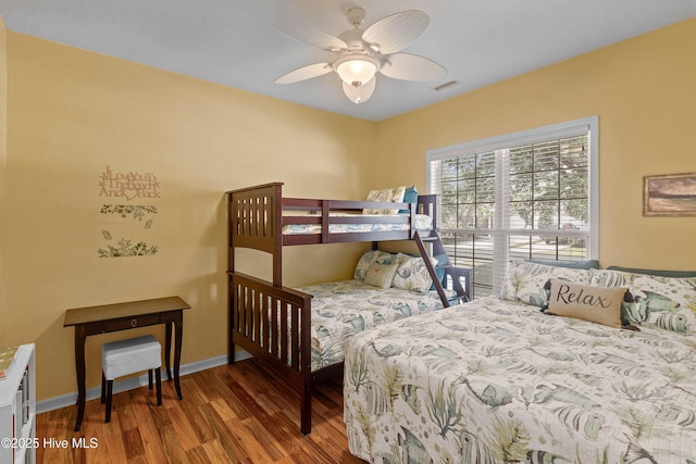 4256 Anderson Dr SE, Southport, NC 28461 - bedroom featuring wood finished floors, baseboards, and a ceiling fan