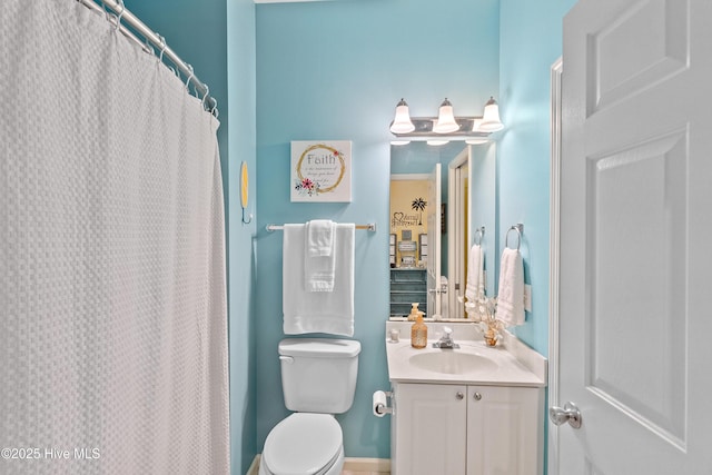 4256 Anderson Dr SE, Southport, NC 28461 - full bath with vanity, toilet, and a shower with curtain