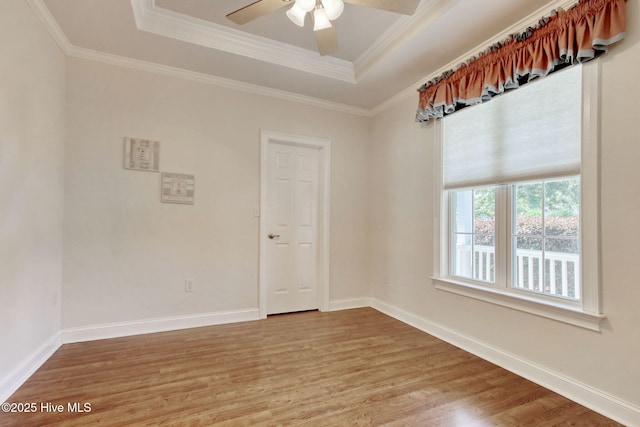 9116 Oak Ridge Plantation Dr, Calabash, NC 28467 - unfurnished room with a raised ceiling, light wood-type flooring, ceiling fan, and crown molding
