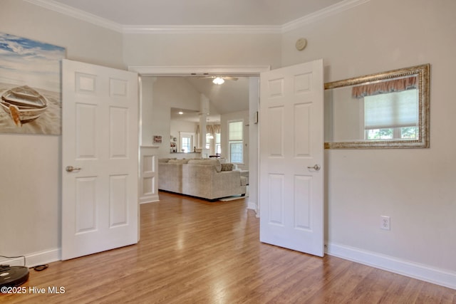 9116 Oak Ridge Plantation Dr, Calabash, NC 28467 - unfurnished room with wood finished floors, crown molding, vaulted ceiling, a ceiling fan, and a smoke detector