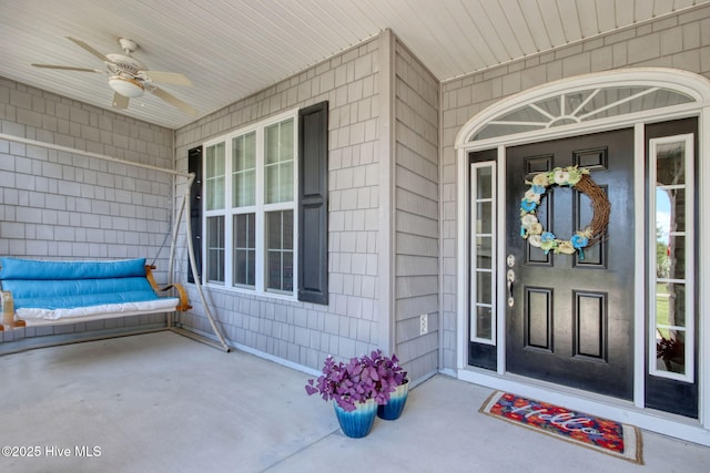9116 Oak Ridge Plantation Dr, Calabash, NC 28467 - view of exterior entry with a ceiling fan and covered porch
