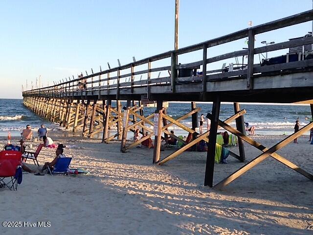 9116 Oak Ridge Plantation Dr, Calabash, NC 28467 - view of home's community featuring a pier and view of water and beach