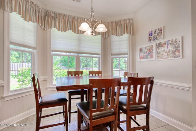 9116 Oak Ridge Plantation Dr, Calabash, NC 28467 - dining room with light tile patterned floors and a chandelier