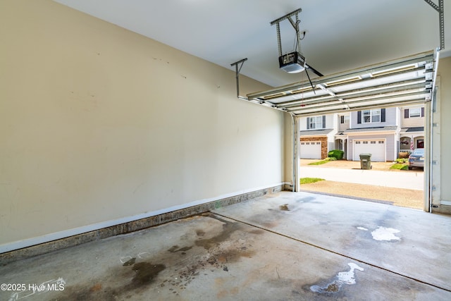 2635 Asher View Ct, Raleigh, NC 27606 - garage featuring a garage door opener and baseboards