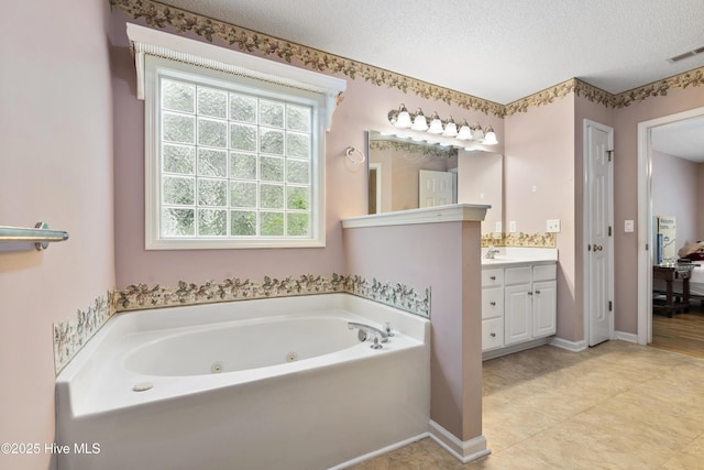 71 Combine Ln SE, Leland, NC 28451 - kitchen featuring stainless steel appliances, a sink, dark countertops, decorative backsplash, and a textured ceiling