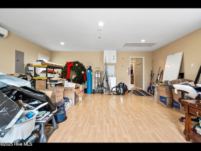 71 Combine Ln SE, Leland, NC 28451 - garage featuring electric panel, recessed lighting, and an AC wall unit