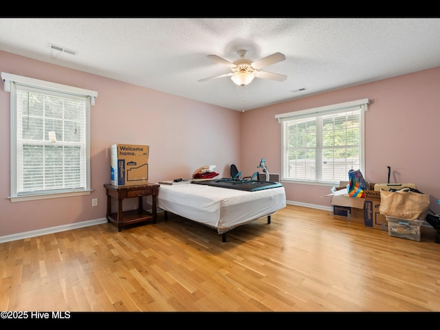 71 Combine Ln SE, Leland, NC 28451 - bedroom with light wood finished floors, baseboards, and ceiling fan