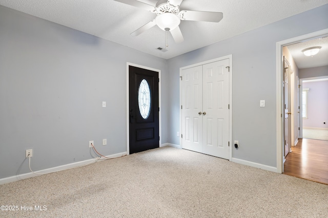 71 Combine Ln SE, Leland, NC 28451 - foyer entrance with carpet, a ceiling fan, baseboards, and healthy amount of natural light