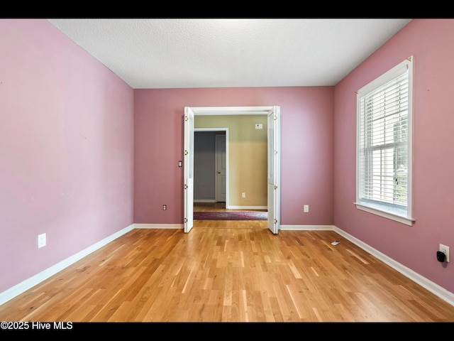 71 Combine Ln SE, Leland, NC 28451 - spare room featuring light wood-style flooring and baseboards