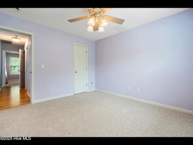 71 Combine Ln SE, Leland, NC 28451 - unfurnished bedroom with carpet flooring, baseboards, and ceiling fan
