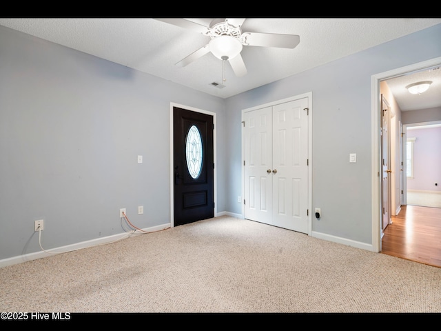 71 Combine Ln SE, Leland, NC 28451 - foyer entrance with carpet, baseboards, and ceiling fan