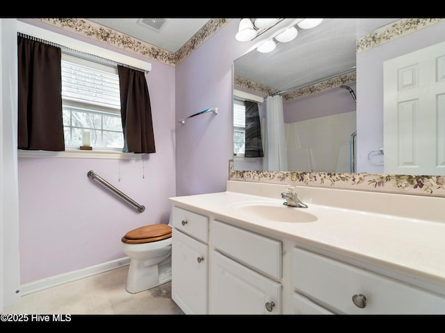 71 Combine Ln SE, Leland, NC 28451 - bathroom featuring toilet, vanity, a shower with curtain, and baseboards