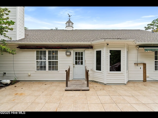 71 Combine Ln SE, Leland, NC 28451 - rear view of house with a patio area and a shingled roof