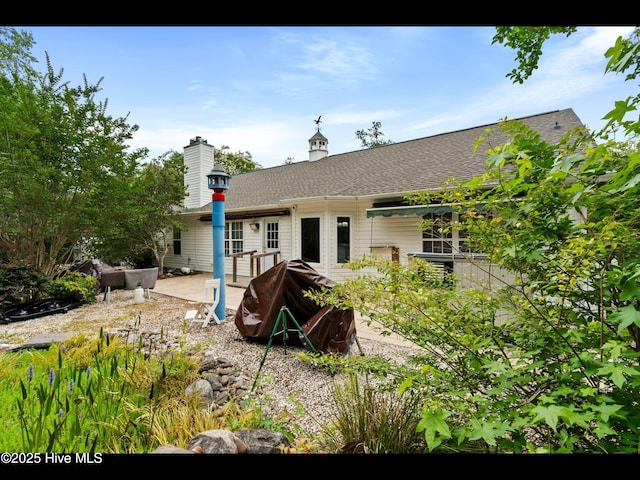71 Combine Ln SE, Leland, NC 28451 - rear view of house with a patio area and roof with shingles