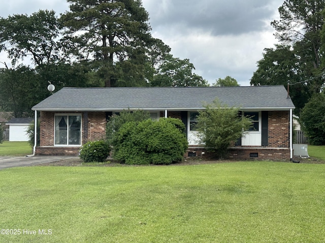 2611 Lisa Ln, Goldsboro, NC 27534 - ranch-style house with a front lawn, brick siding, cooling unit, and a shingled roof