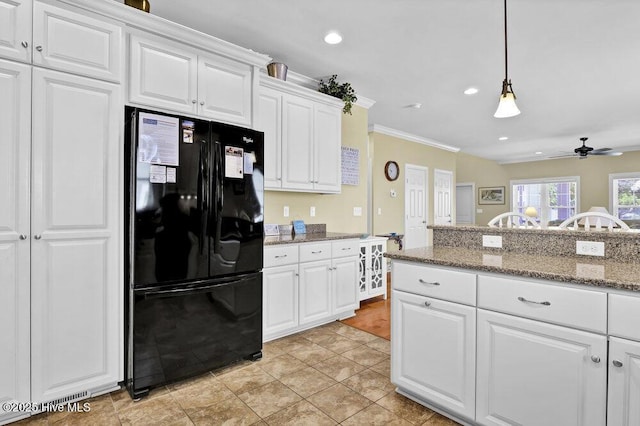 421 30th St, Sunset Beach, NC 28468 - kitchen featuring freestanding refrigerator, ceiling fan, white cabinetry, ornamental molding, and decorative light fixtures