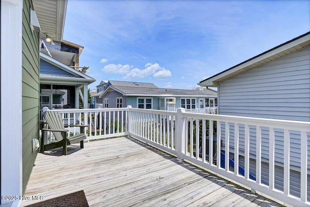 421 30th St, Sunset Beach, NC 28468 - wooden terrace featuring a residential view