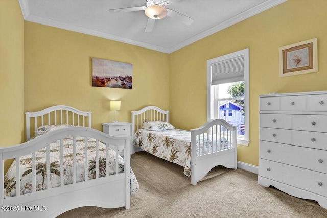 421 30th St, Sunset Beach, NC 28468 - carpeted bedroom with ornamental molding, baseboards, and ceiling fan