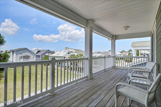 421 30th St, Sunset Beach, NC 28468 - wooden terrace featuring a residential view and a lawn