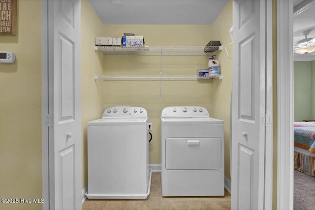 421 30th St, Sunset Beach, NC 28468 - washroom featuring washing machine and dryer, baseboards, and light tile patterned flooring